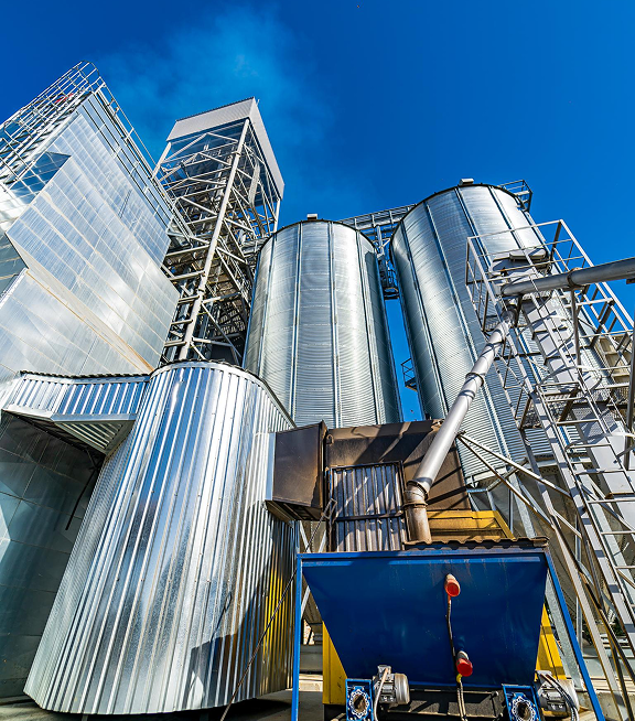 Grain silos against a clear blue sky